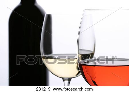 Close-up of two glasses of red and white wine View Large Photo Image Stock Photo - Close-up of two glasses of red and white wine . Fotosearch