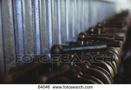 Stock Photograph - Close-up of valves in row . Fotosearch