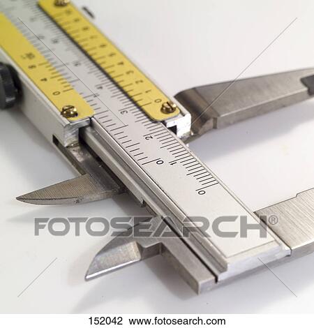 Stock Image - Close-up of vernier calliper measuring scale . Fotosearch