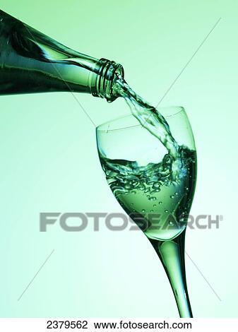 Close-up of water being poured into stem glass View Large Photo Image Stock Image - Close-up of water being poured into stem glass . Fotosearch