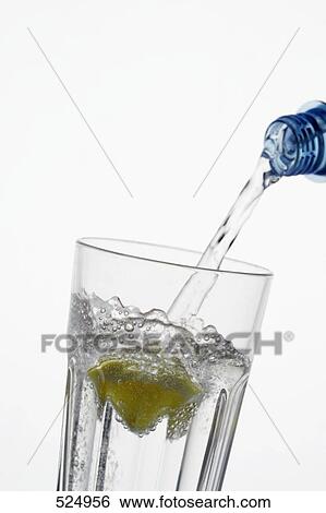 Close-up of water being poured into glass View Large Photo Image Stock Photograph - Close-up of water being poured into glass . Fotosearch