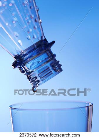 Close-up of water droplets being poured from bottle into glass View Large Photo Image Stock Image - Close-up of water droplets being poured from bottle into glass . Fotosearch