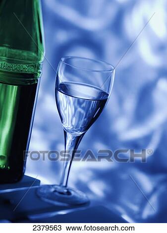 Close-up of water glass and bottle View Large Photo Image Stock Image - Close-up of water glass and bottle . Fotosearch