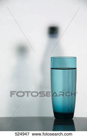 Stock Photo - Close-up of water glass on table . Fotosearch