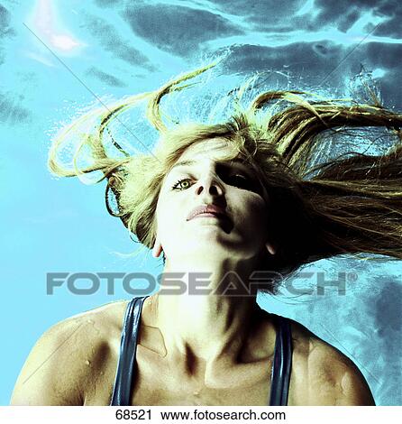 Close-up of young woman relaxing in swimming pool View Large Photo Image Stock Image - Close-up of young woman relaxing in swimming pool . Fotosearch