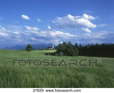 Clouds in sky above rural landscape, Pilgrimage Church, Wilparting, Irschenberg, Bavaria, Germany View Large Photo Image Stock Photo - Clouds in sky above rural landscape, Pilgrimage Church, Wilparting, Irschenberg, Bavaria, Germany . Fotosearch