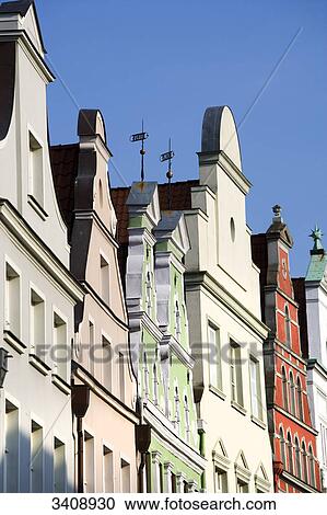 Stock Image - Colourful house fronts, Wismar, Germany, low angle view . Fotosearch