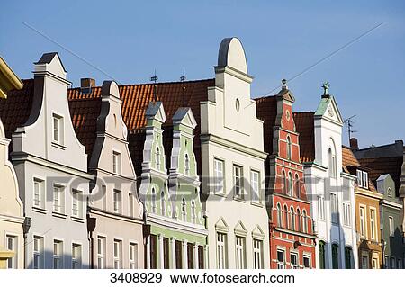 Stock Photo - Colourful house fronts, Wismar, Germany, low angle view . Fotosearch