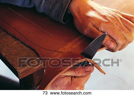 Stock Image - cutting of a leather saddle, close-up . Fotosearch