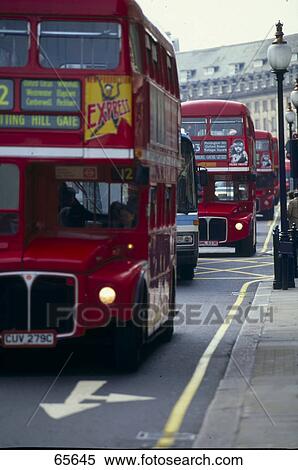 Double-decker buses on road, London, England View Large Photo Image Stock Photography - Double-decker buses on road, London, England . Fotosearch