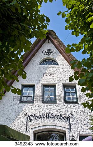 Facade of a Cafe in Nordstrand, Schleswig-Holstein, Germany View Large Photo Image Stock Image - Facade of a Cafe in Nordstrand, Schleswig-Holstein, Germany . Fotosearch