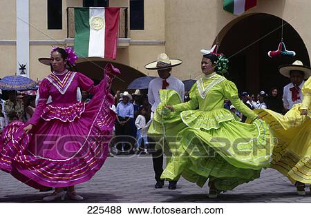 Stock Photo - Female folk dancers performing in street, Mexico . Fotosearch