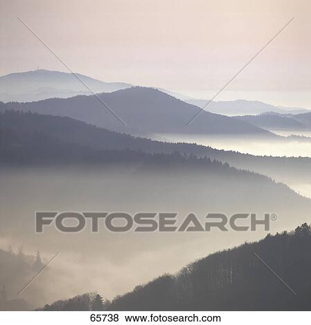 Fog over mountains at dawn, Black Forest, Baden-Wuerttemberg, Germany View Large Photo Image Stock Photo - Fog over mountains at dawn, Black Forest, Baden-Wuerttemberg, Germany . Fotosearch