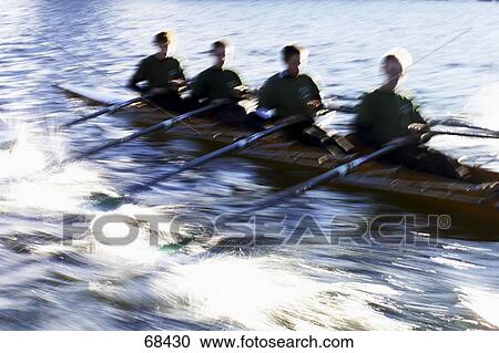Four man in rowing boat, blurred View Large Photo Image Stock Image - Four man in rowing boat, blurred . Fotosearch