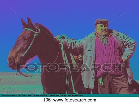 Stock Photograph - Gaucho standing with Criollo horse, Patagonia, Argentina . Fotosearch
