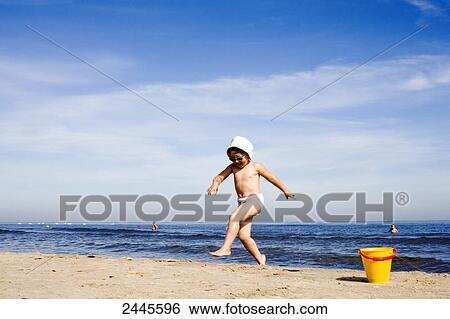 Girl running on beach, Swinemuende, Usedom, Germany View Large Photo Image Stock Photograph - Girl running on beach, Swinemuende, Usedom, Germany . Fotosearch
