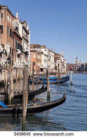 Stock Photo - Gondolas in front of a row of houses on the Canale Grande, Venice, Italy . Fotosearch