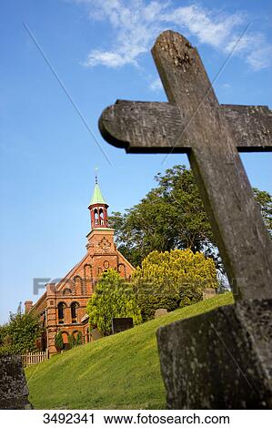 Grave cross on a cemetery in Sueden, Nordstrand, Germany, low angle view View Large Photo Image Stock Image - Grave cross on a cemetery in Sueden, Nordstrand, Germany, low angle view . Fotosearch