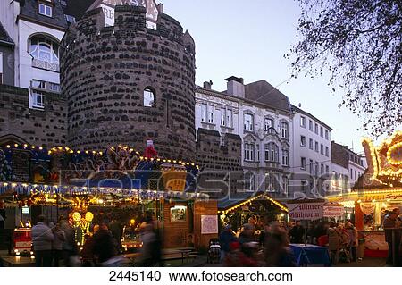 Group of people at market lit up at dusk View Large Photo Image Stock Image - Group of people at market lit up at dusk . Fotosearch