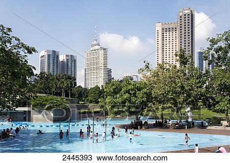 Stock Image - Group of people enjoying at water park . Fotosearch