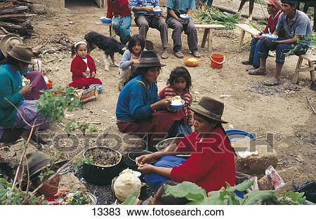 Stock Image - Group of people having food, Peru . Fotosearch