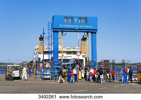 Group of people in front of a ferry, Wittduen, Amrum, Schleswig-Holstein, Germany View Large Photo Image Stock Image - Group of people in front of a ferry, Wittduen, Amrum, Schleswig-Holstein, Germany . Fotosearch