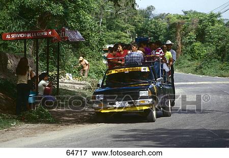 Group of people in pick-up truck near bus stop, El Salvador View Large Photo Image Stock Photo - Group of people in pick-up truck near bus stop, El Salvador . Fotosearch