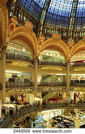 Stock Photo - Group of people in shopping mall, Paris, France . Fotosearch