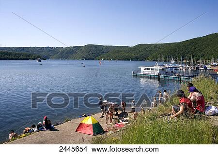Group of tourists at coast, Eifel, North Rhine-Westphalia, Germany View Large Photo Image Picture - Group of tourists at coast, Eifel, North Rhine-Westphalia, Germany . Fotosearch