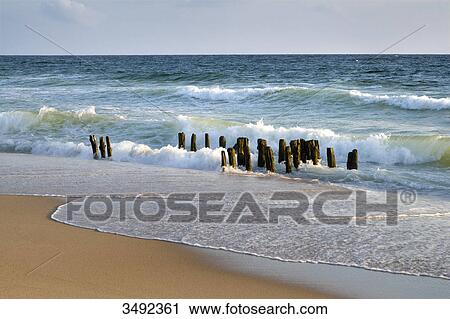 Stock Image - Groynes on a beach, Rantum, Sylt, Germany . Fotosearch