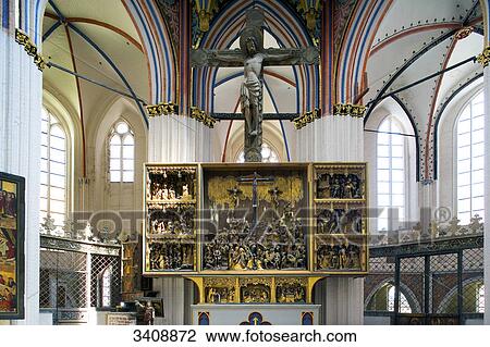 Stock Image - High altar in St. Nikolai Church, Stralsund, Germany, low angle view . Fotosearch