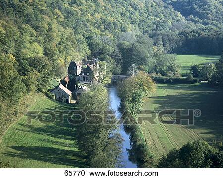 Stock Image - High angle view of a river flowing through a valley, River Cure, Burgundy, France . Fotosearch