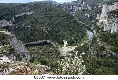 Stock Photo - High angle view of a river flowing through a gorge, Provence, France . Fotosearch