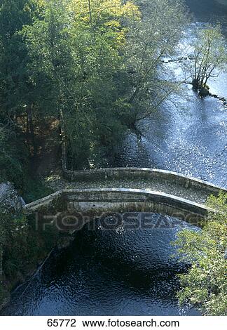 High angle view of arch bridge across river, Cure River, Morvan, Burgundy, France View Large Photo Image Stock Image - High angle view of arch bridge across river, Cure River, Morvan, Burgundy, France . Fotosearch