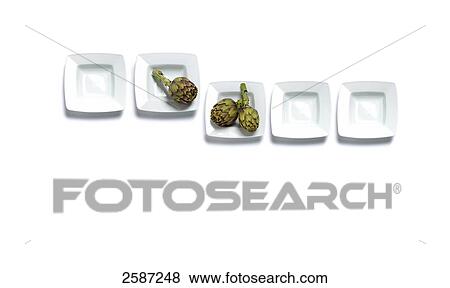 High angle view of artichokes on plates View Large Photo Image Stock Photo - High angle view of artichokes on plates . Fotosearch