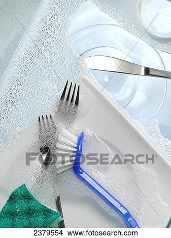 High angle view of brush and forks with soap sud View Large Photo Image Picture - High angle view of brush and forks with soap sud . Fotosearch