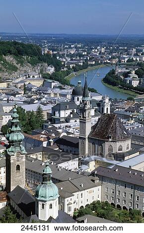 Stock Image - High angle view of buildings in town, Salzach River, Salzburg, Austria . Fotosearch