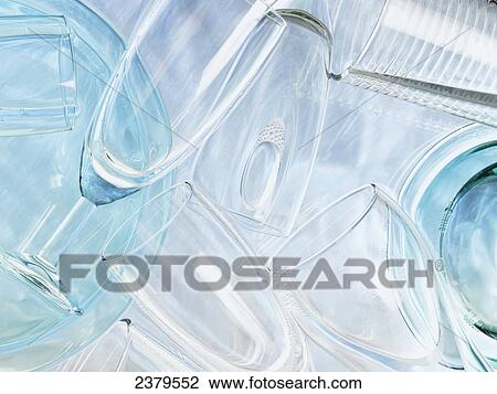 Stock Image - High angle view of champagne flutes in water . Fotosearch