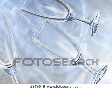 High angle view of champagne flutes in water View Large Photo Image Stock Photo - High angle view of champagne flutes in water . Fotosearch