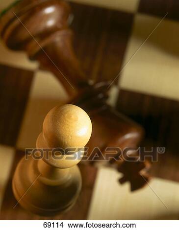 Picture - High angle view of chess pieces on chessboard . Fotosearch