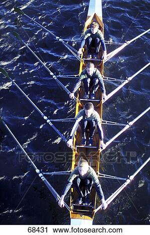 High angle view of four men rowing boat in river View Large Photo Image Stock Image - High angle view of four men rowing boat in river . Fotosearch