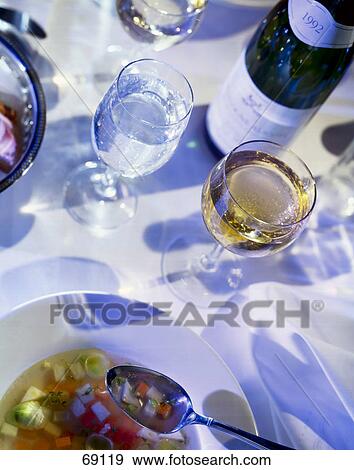 Stock Photo - High angle view of glasses of white wine and water . Fotosearch