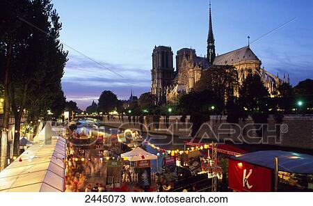 Stock Image - High angle view of people at market, Seine River, Notre-Dame, Ile De La Cite, Paris, France . Fotosearch