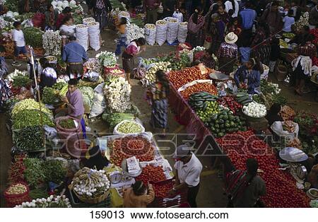 Stock Image - High angle view of people at vegetable market, Chichicastenango, Guatemala . Fotosearch