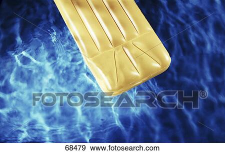 High angle view of pool raft in swimming pool View Large Photo Image Stock Photo - High angle view of pool raft in swimming pool . Fotosearch