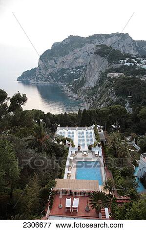 High angle view of swimming pool in hotel, Capri, Campania, Italy View Large Photo Image Stock Photo - High angle view of swimming pool in hotel, Capri, Campania, Italy . Fotosearch
