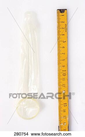 Picture - High angle view of tap measure and condom . Fotosearch
