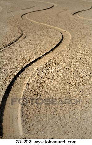High angle view of tire tracks on sand View Large Photo Image Stock Image - High angle view of tire tracks on sand . Fotosearch