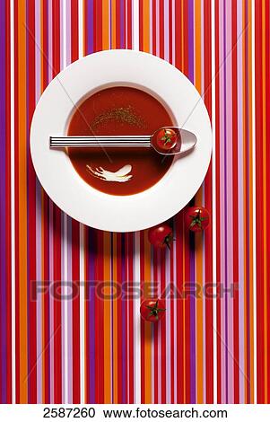 High angle view of tomatoes and a bowl of soup View Large Photo Image Stock Image - High angle view of tomatoes and a bowl of soup . Fotosearch