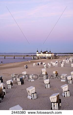 Hooded beach chairs on beach with pier in background, Ahlbeck, Usedom, Mecklenburg-West Pomerania, Germany View Large Photo Image Stock Image - Hooded beach chairs on beach with pier in background, Ahlbeck, Usedom, Mecklenburg-West Pomerania, Germany . Fotosearch